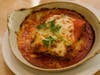 Lasagna Bolognese: Layered lasagna in béchamel, veal & beef ragu, marinara & parmesan cheese.
