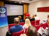 Carmen Miller Esq., (at podium) former Tampa Bay Assistant Public Defender, gave a talk on the Baker Act and its flaws.