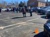 Driveway Choir participants take a brief break in the parking lot of The First Church in Swampscott, Congregational, by stepping out of their cars to stretch and chat, masked and socially distanced. It had been a year since they last convened in person. 