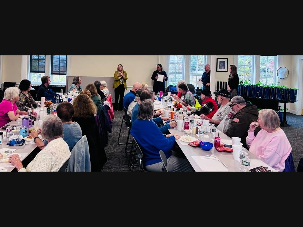Photo Cutline:  North Reading Senior Center Director Jacqueline Quinn introduces members of  the StonehamBank Cyber Squad – (L-R) Jeana DeBenedetto, Shawn Kelley & Janet Hill - who spoke with attendees about fraud, scams and ways to stay Cyber Safe.