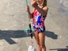 Katie Drago, 8, of Aston Park, Pa, shows off the 11.5-inch fluke she caught at the Ocean City Fishing Club's Boys and Girls Surf Fishing Tournament