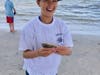 Carter Linden, 11, of Ocean City, beams while holding one of the fish he caught at the Ocean City Fishing Club's Boys and Girls Surf Fishing Tournament 