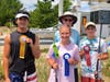 Ed Hoban, Ocean City Fishing Club chairperson for the Boys and Girls Surf Fishing Tournament, congratulates top anglers in the 14-16 years old tier: Alexis Erazmus, first place (center), Xavier Ladik, second (right), and Adam Madkour, third
