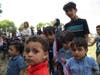 Children holding the flag of South Yemen.