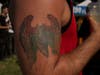 A man with a tattoo of modern day Palestine and Israel.