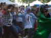 Friends dancing in a circle formation. The men and women danced in separate circles to honor tradition.