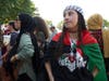 A Palestinian American girl wearing a shirt with the Superman logo in the colors of the Palestinian flag.