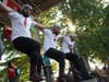 Freedom Dabka Group dancing on stage wearing Pure Pali shirts to support Palestine.