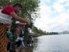 At a water ceremony, members paid respect to natural bodies of water. Participants poured water from natural bodies of water they each collected from home to pour into the Harlem River.