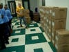 Boxes containing bags of food were stacked against a wall as the event went. At the end, there were 10,000 total rice and beans meals prepared.