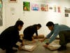 Volunteers prepared artwork prints for sale a few hours before the Art for Tibet event on Nov. 7.