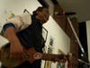 Tibetan musician, Tenzin Choegyal, practiced his dranyen before his performance at Art for Tibet.