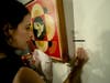 “Dove Geometric (red)," hanging on the wall, by iconic American artist Shepard Fairey was one of the top items at the auction. 