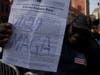 A Trump supporter showed a paper that said "2020 MAGA (Make America Great Again)."