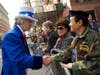 A man dressed as Uncle Sam (left) shook hands with a South Korean Vietnam War veteran (right).