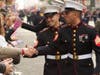 U.S. Marines shook hands with parade attendees.