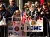 Parade-goers showed signs supporting the troops and veterans.
