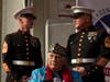 U.S. Marines and veterans gathered on stage at the starting location of the parade.