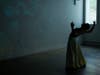 Ahmad Joudeh practiced his dance routine before his official performance at Prime Produce. A projector played images of war-torn Syria on the wall behind Joudeh. 