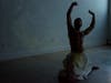 Ahmad Joudeh practiced his dance routine before his official performance at Prime Produce. A projector played images of war-torn Syria on the wall behind Joudeh. 