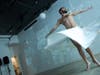 Ahmad Joudeh practiced his dance routine before his official performance at Prime Produce. A projector played images of war-torn Syria on the wall behind Joudeh. 