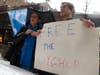 Members of Uyghur Rally, Corby Johnson, left, and Yosef Roth, right, demonstrated outside the building hosting the China Conference: US. 