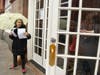 Nicole Izsak, left, a former Hong Kong resident, delivered flyers outlining the Uyghur struggle to conference attendees.