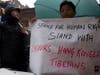 Dorjee Tseten, left, executive director of Students for a Free Tibet, demonstrated next to Tenzin Sonam, operations manager of SFT.
