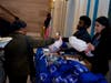 Sherman Jones, Assistant District Attorney at the Brooklyn DA's Office Human Trafficking Unit, center right, and Nikita Mehta, who holds the same position, right, accepted donations, such as toiletries from event attendees for trafficking survivors.