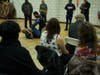 Derrick Strong, on the ground left, owner of Team Demolition Mixed Martial Arts gym, showed the crowd basic self-defense techniques on Rachaun Rogers, a student of his. Strong described moves to fight off human traffickers. 