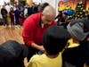 Bboy Indio, center, founder and coach of 6 Steps Before the Lord dance crew, coached his students before they battled Dynamic Kids crew waiting behind Indio.