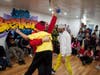 Bboy Indio, celebrated by raising his student bboy Quake after Quake won the beginner level dance tournament.