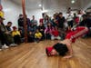 Bboy Fireball, age 8, right, danced as his opponent bboy Darth Vade stood watching behind him. Fireball won the beginner plus level tournament.