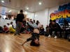 Bboy Yum Yum, center, in the advanced level battle executed a freeze against bboy Rebel, left, as three dance judges from left to right, bboy Pollo, bboy Evade and bboy Pop, assessed the battle. 