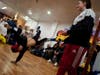 10-year-old Japanese American bboy, Quiet Storm, left, received one of the biggest crowd reactions of the night sticking a move matching the beat of the music playing during the battle.