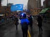 Shamim Hossain waved the flag of East Turkestan to support Uyghur human rights in China as he and other Uyghur supporters marched as part of the Chinese New Year parade.