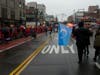 On Main Street, Flushing, dozens of Chinese flags lined both sides of the street as a group, right, that was part of the Chinese New Year parade advocated for human rights for Uyghurs under the rule of the Chinese communist government in Xinjiang, China.