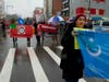 On Main Street, Flushing, dozens of Chinese flags lined both sides of the street as marchers who were part of the Chinese New Year parade advocated for human rights for Uyghurs under the rule of the Chinese communist government in Xinjiang, China.