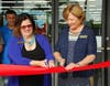 Manatee County Commissioners Misty Servia and Betsy Benac help Manatee Habitat ReStore kick off a day-long anniversary celebration with a ribbon cutting ceremony.
