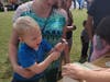Jade Richmond and her son build a birdhouse.