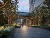 The Rowan's lush landscaped entryway