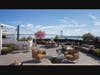 The Vista Skydeck, a landscaped rooftop with views of New York Harbor and the Verrazzano-Narrows Bridge. 