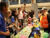 Girl Scout Cadettes learn how water supply is delivered to Orange County before engineering their own gravity-fed water delivery system with Tiffany Baca at the Municipal Water District of Orange County booth.