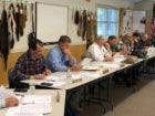 Paula Tracy photo Members of the New Hampshire Fish and Game Commission met Wednesday in Holderness. Fish and Game Director Glenn Normandeau is fourth from left in white shirt, sitting next to chairman Robert Phillipson sitting on Normandeau's right.
