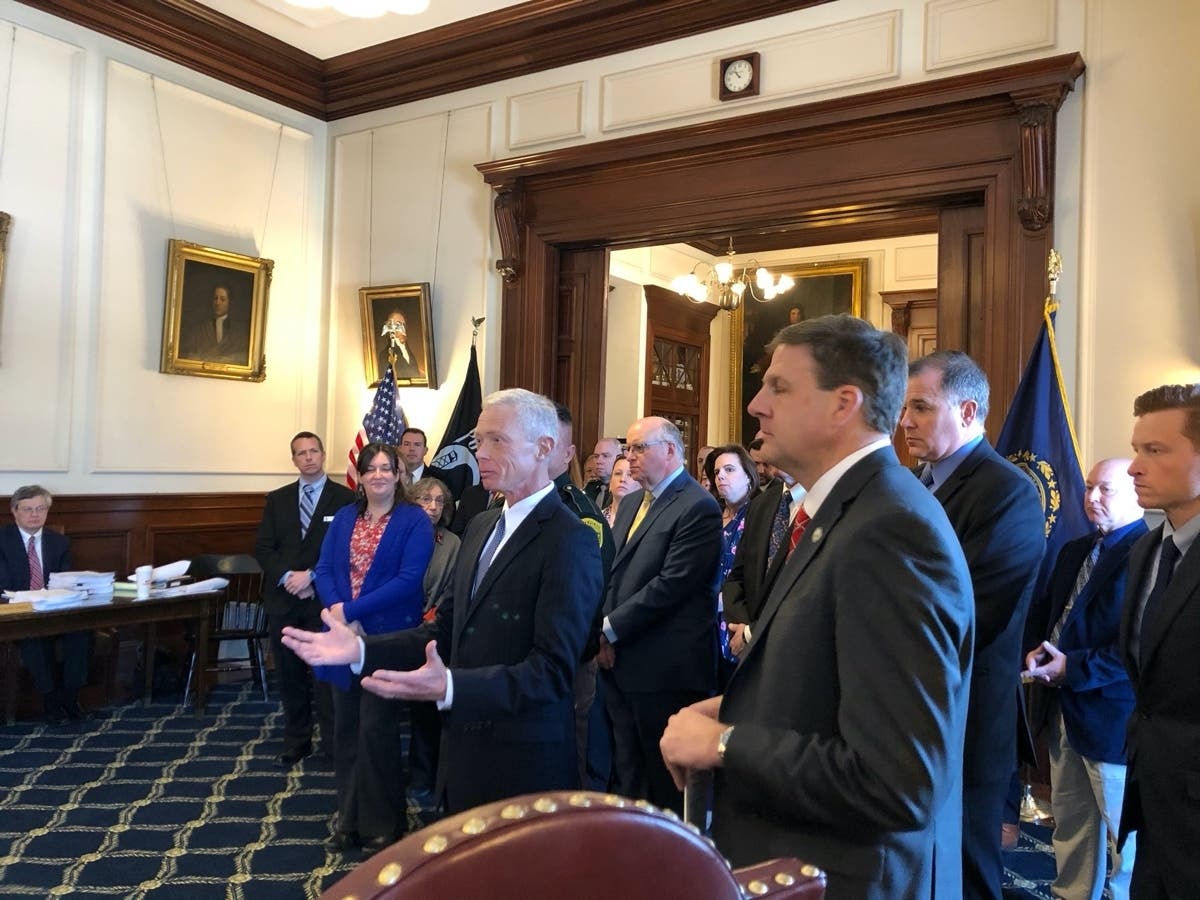 Attorney General Gordon MacDonald and Gov. Chris Sununu are pictured with a group at the Executive Council meeting on Wednesday addressing people who help stop human trafficking in the state.