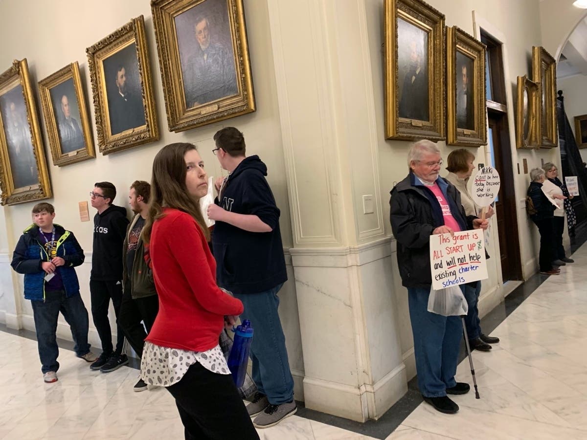 Students from the Capital City Charter School in Concord are pictured at left while opponents of legislation that would authorize the acceptance of a $46 million federal grant to increase the number of charter schools are pictured at right.