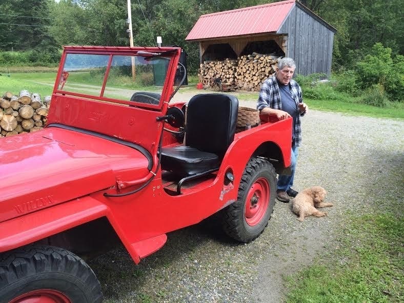 John Harrigan is pictured at his Colebrook farm with his "attack dog" Millie.