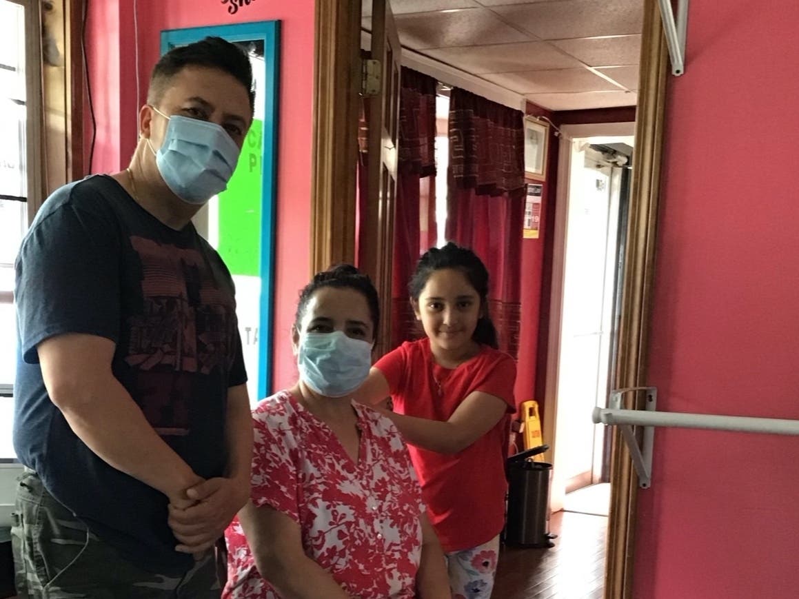 Rajendra and Uma Dada and their daughter Sophia are pictured at Cafe Momo in Manchester.