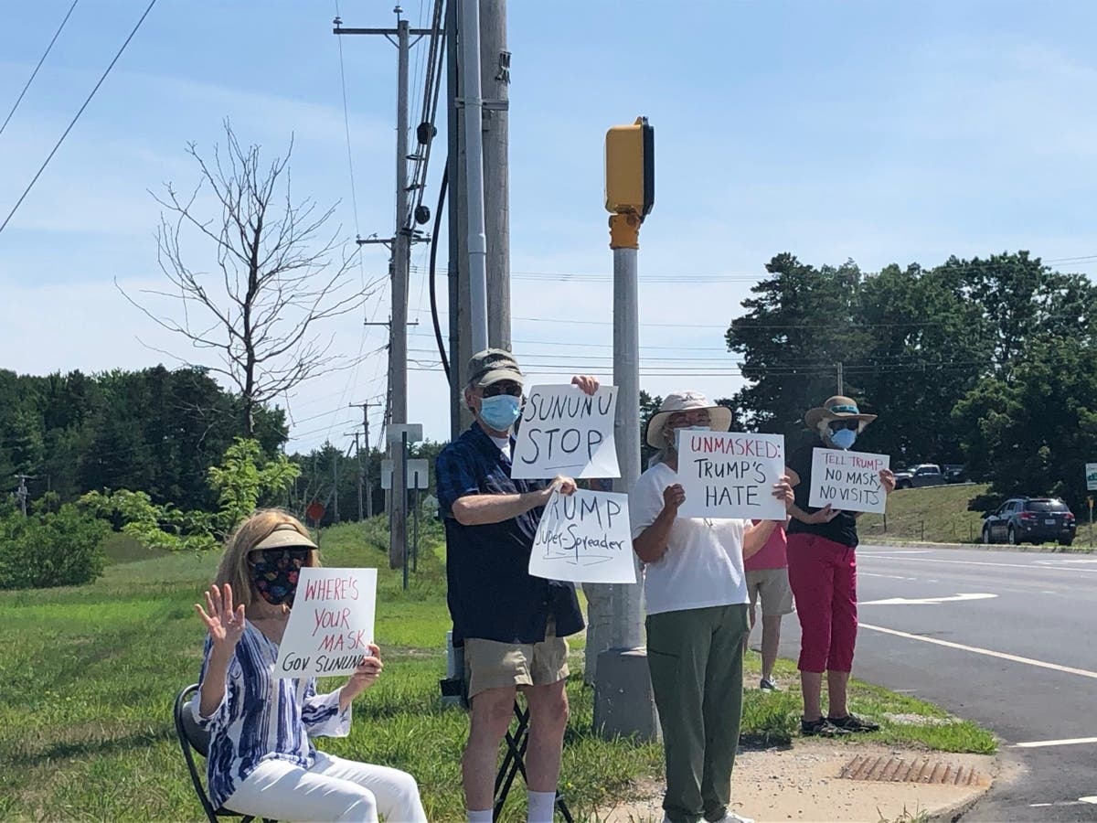 Protesters greeted Gov. Chris Sununu outside his news conference Tuesday in Concord.
