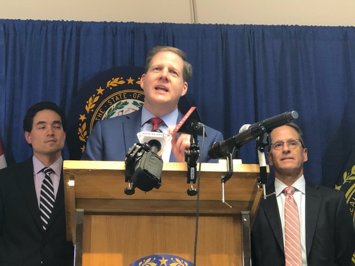 In this file photo from March, Gov. Chris Sununu speaks at news conference in which he closed all schools in New Hampshire. State Epidemiologist Dr. Benjamin Chan, left, and Education Commissioner Frank Edelblut are behind him.